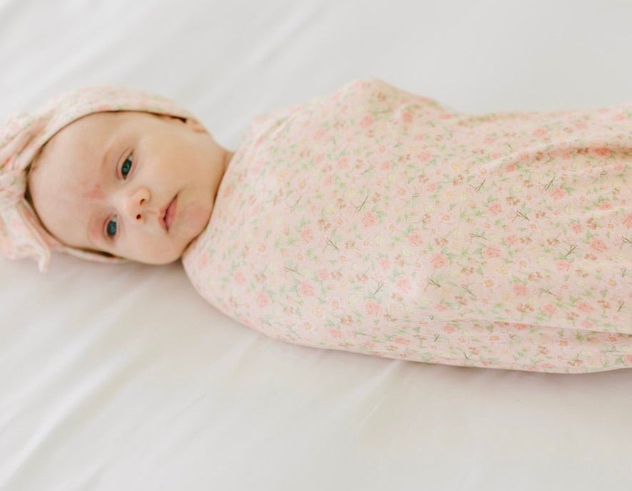 Classic brushed newborn essentials bundle featuring a long sleeve top with ruffle cuffs.