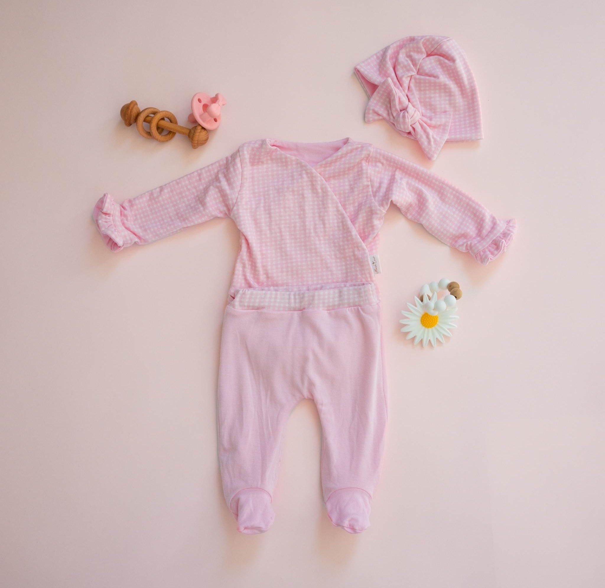 Reversible baby ruffle cuff long sleeve baby onesie outfit bundle made from silky modal fabric in baby pink gingham design.