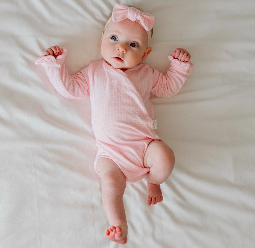 Baby Pink Gingham design ruffle cuff baby winged bodysuit in silky modal fabric.