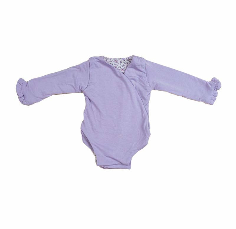 Reversible Purple Posies design ruffle cuff long sleeved winged bodysuit in silky modal fabric.