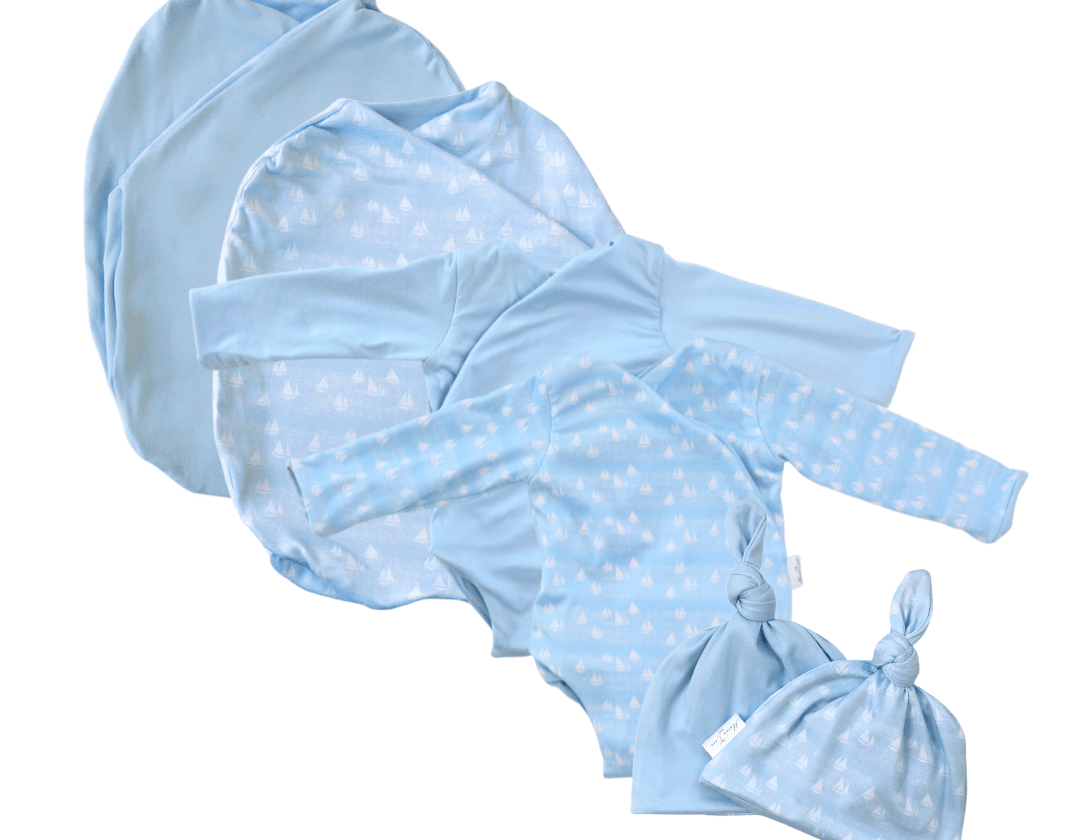Newborn bundle with long sleeve essentials in classic brushed fabric with sailboat shores design.