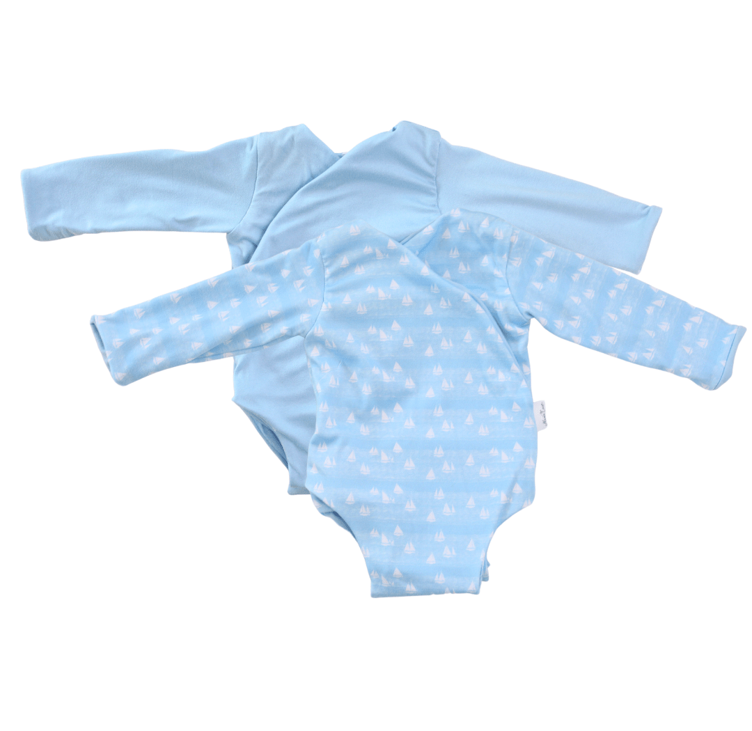 Sailboat shores design long-sleeve baby onesie in classic brushed fabric.