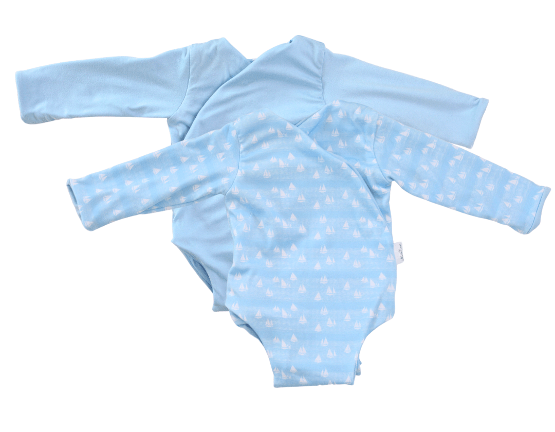 Sailboat shores design long-sleeve baby onesie in classic brushed fabric.