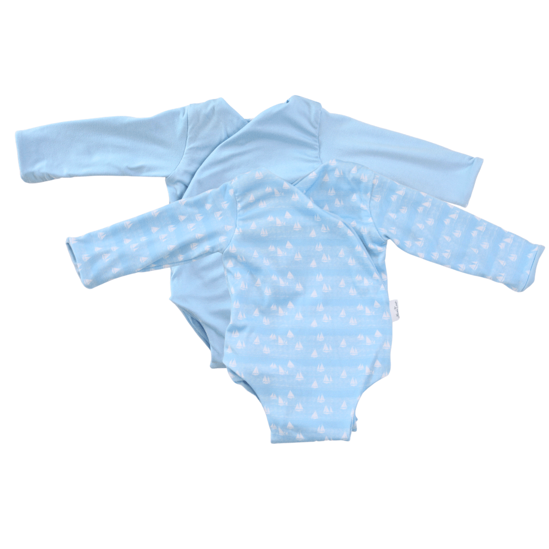 Sailboat shores design long-sleeve baby onesie in classic brushed fabric.