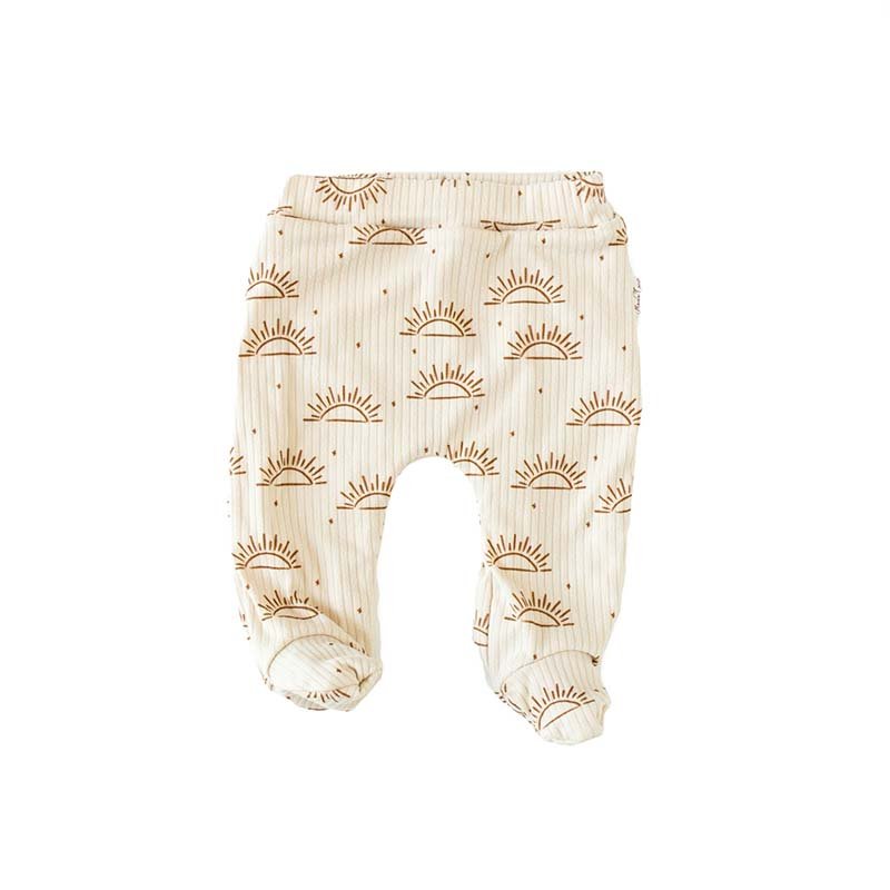 Baby footie pants crafted from a soft bamboo cotton fabric featuring the Sandy Sunsets print.