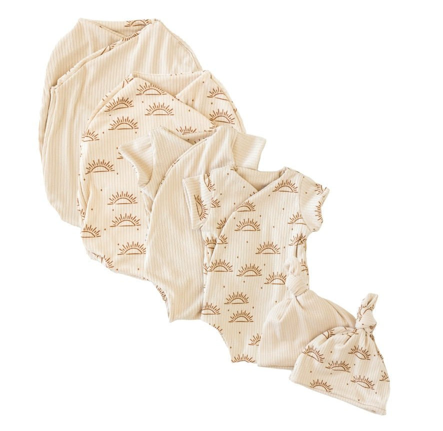 Newborn essentials bundle with short sleeves in classic brushed fabric with sandy sunsets design.