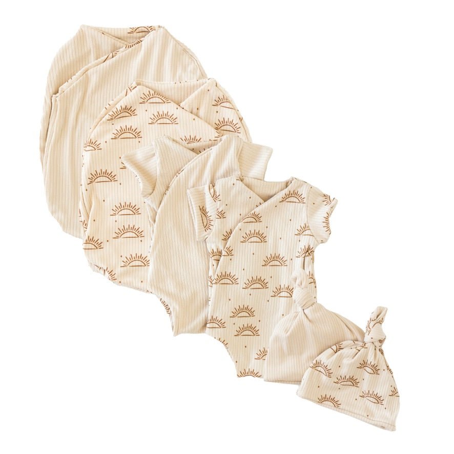 Newborn essentials bundle with short sleeves in classic brushed fabric with sandy sunsets design.