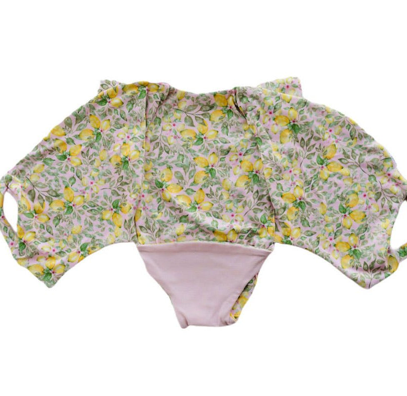 Pink Lemonade short-sleeve bodysuit for baby in Classic Brushed fabric styles with a cheerful floral print.