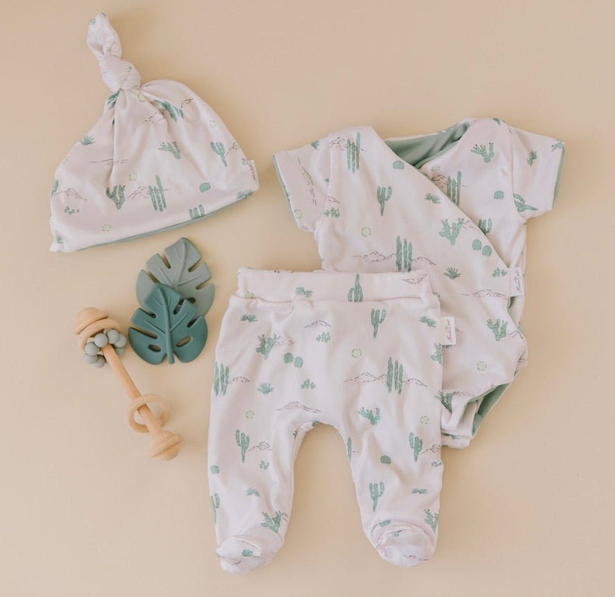 Short-sleeve onesie outfit bundle in desert sunsets design.