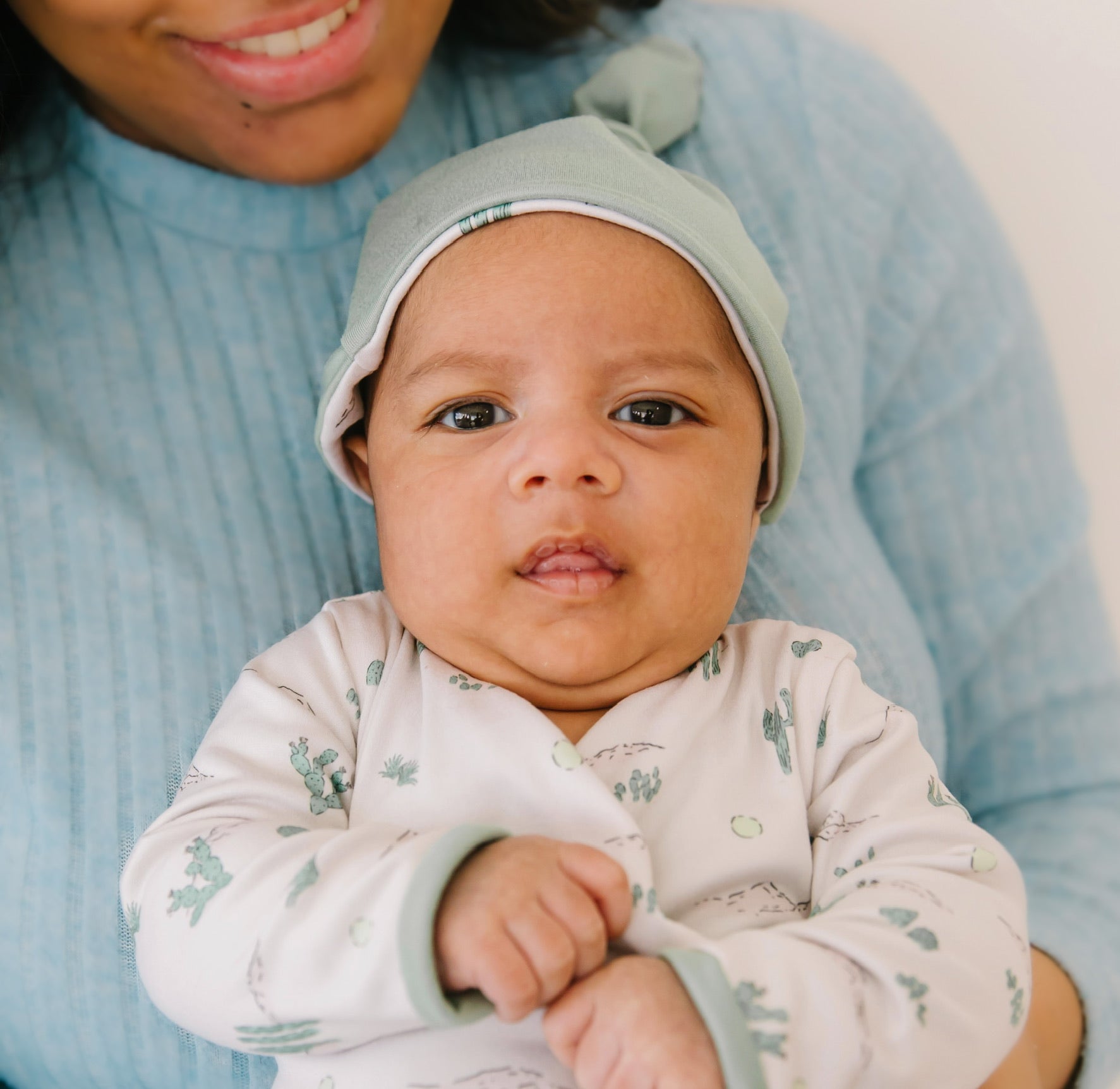 Long-sleeve onesie outfit bundle in desert sunsets design.