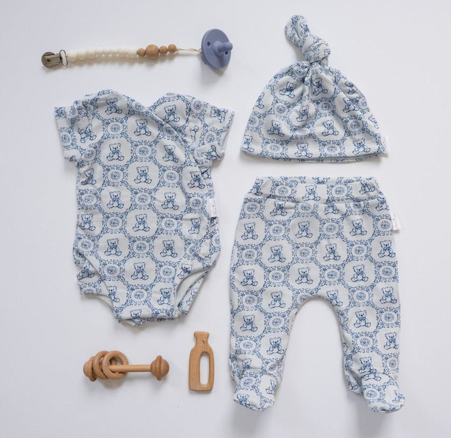 Short-sleeve baby onesie outfit bundle made from bamboo cotton in teddy tiles design.