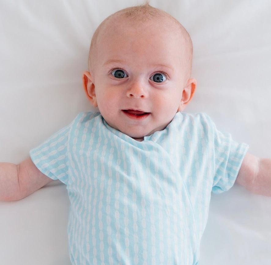Lil surfer short-sleeve baby onesie bodysuit in silky modal.