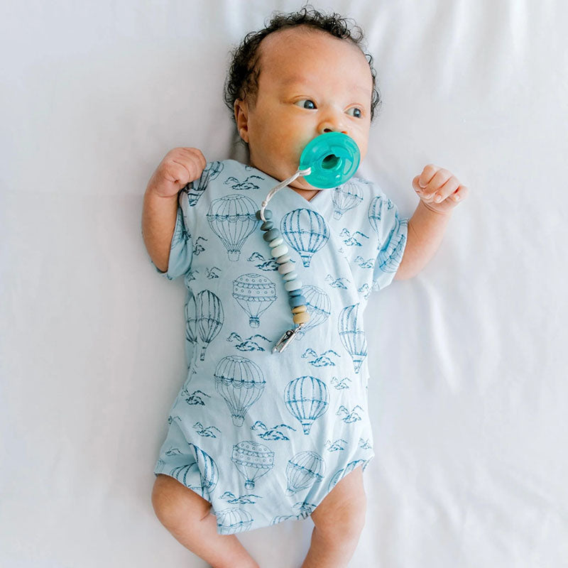 Short-sleeve baby onesie outfit bundle made from bamboo cotton in bon voyage design.