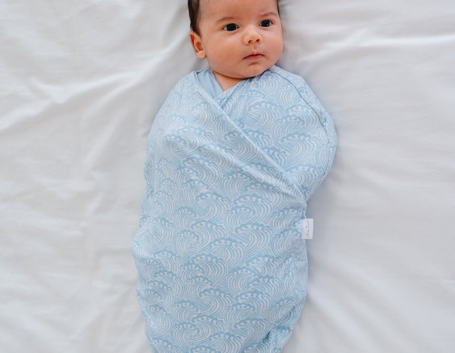 Classic-brushed short sleeve newborn essentials bundle in blue swells design.