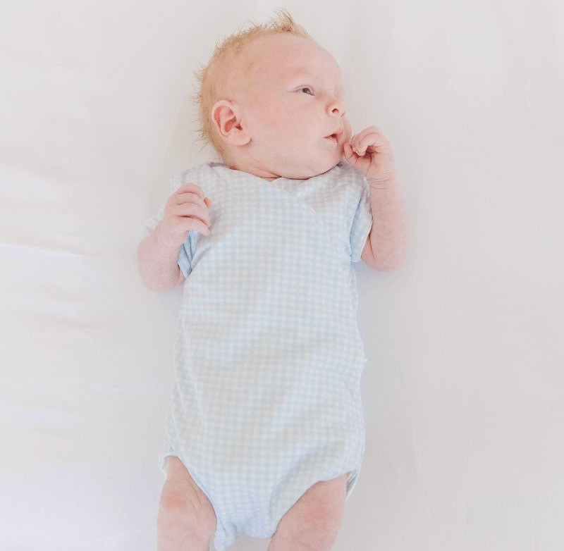 Baby Blue Gingham design short-sleeved winged bodysuit.