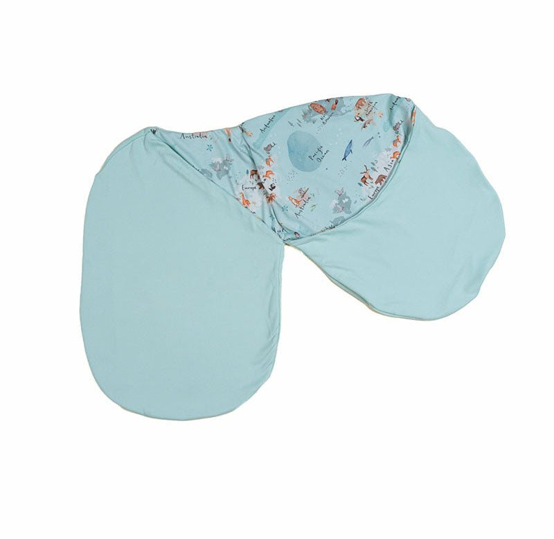 Reversible newborn baby cocoon swaddle featuring World Traveler design Silky Modal fabric.