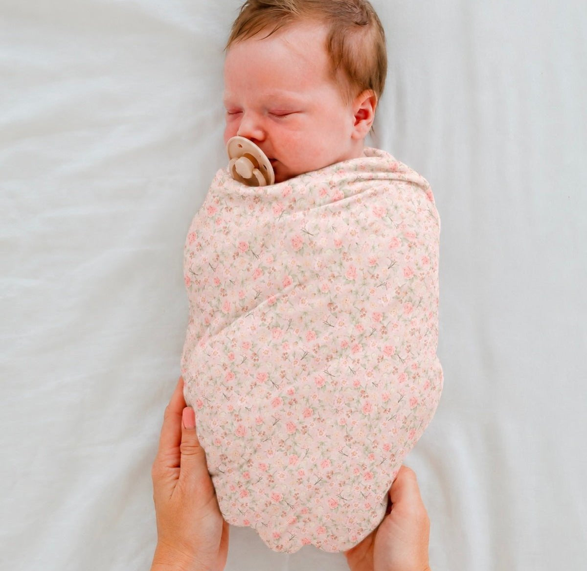 Silky Modal baby cocoon swaddle in Dusty Roses for newborn comfort.