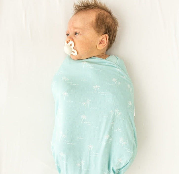 Soft baby cocoon swaddle made from Silky Modal in the Honeydew Palms design.