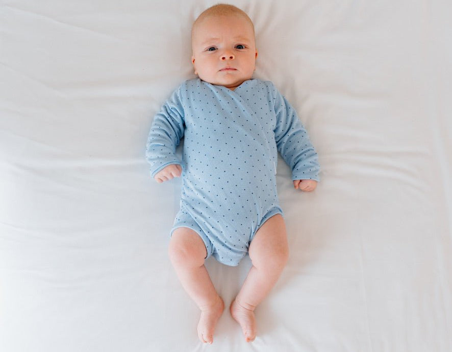 Dotted Blues design baby winged bodysuit in silky modal fabric.