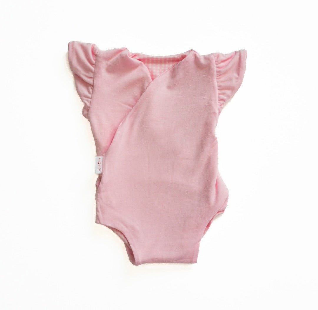 Reversible Baby Pink Gingham design flutter sleeve baby onesie in silky modal fabric.