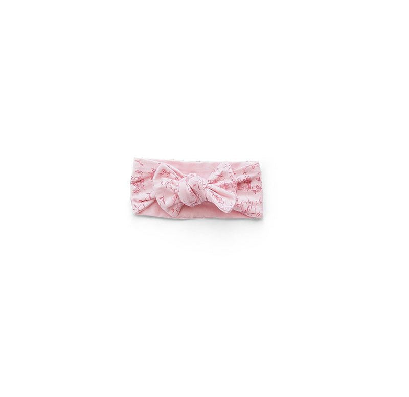 Whimsical garden design baby headwrap with bow made from breathable bamboo and organic cotton fabric.