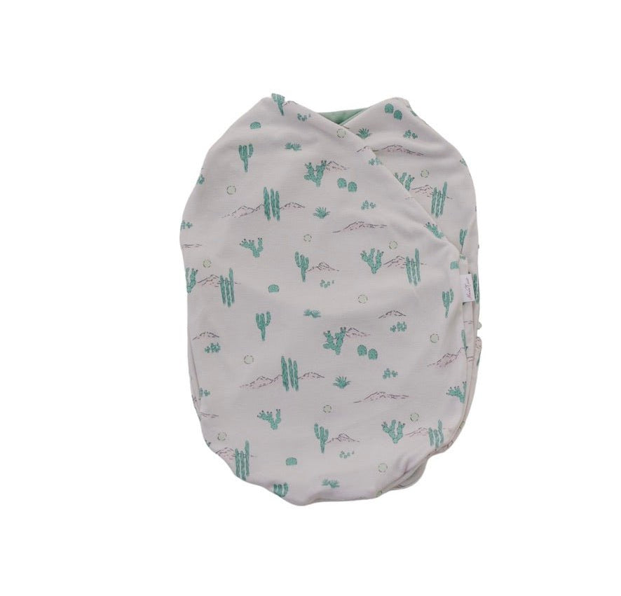 Silky Modal baby cocoon swaddle in Desert Sunsets for newborn comfort.