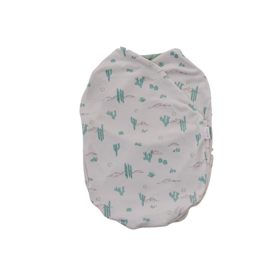 Silky Modal baby cocoon swaddle in Desert Sunsets for newborn comfort.