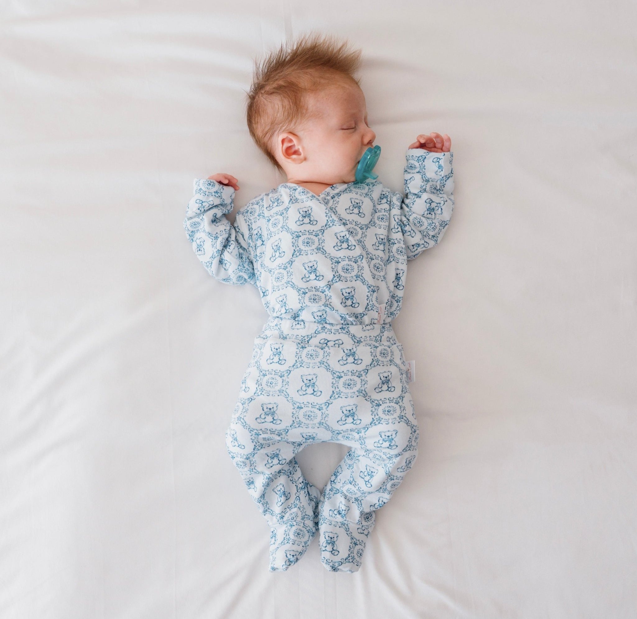 Long-sleeve winged bodysuit newborn baby essentials bundle in bamboo cotton.