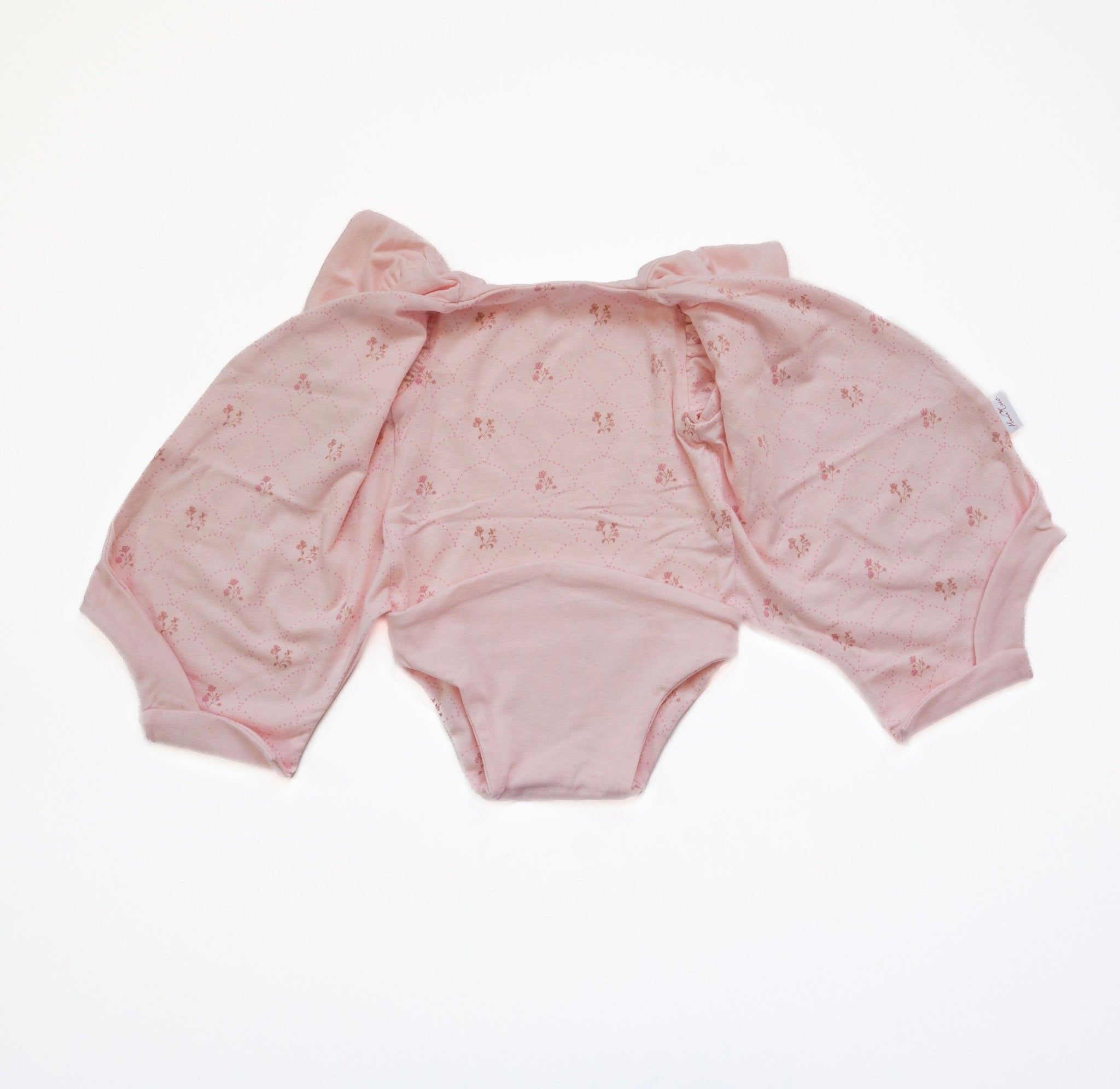 Flutter sleeve onesie for babies in dainty dots design.