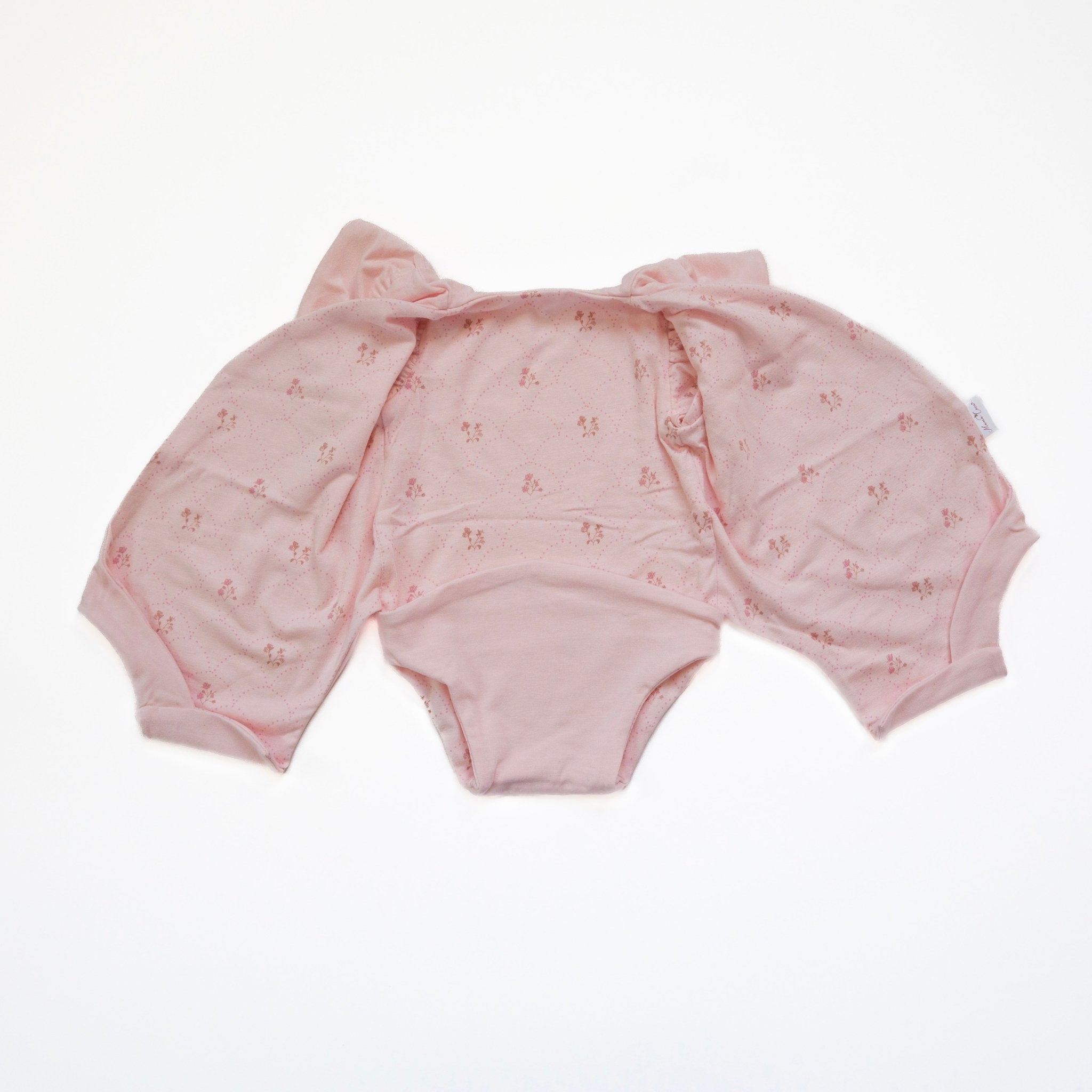 Flutter sleeve onesie for babies in dainty dots design.