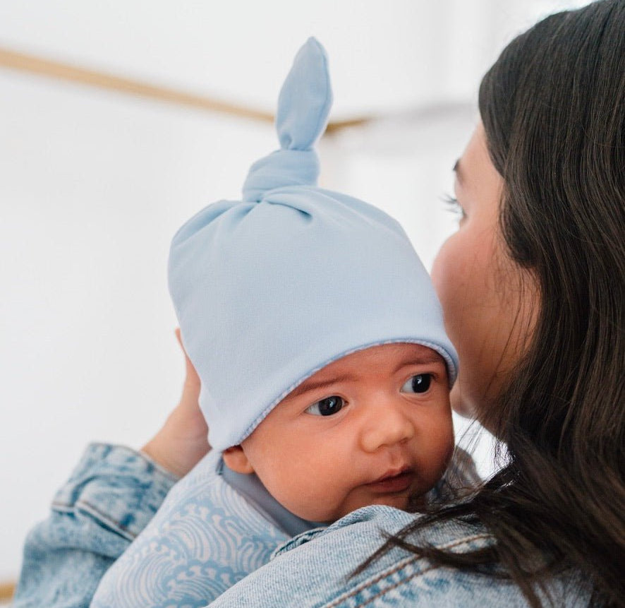 Reversible Blue Swells baby beanie made from classic brushed fabric for a soft cozy fit.