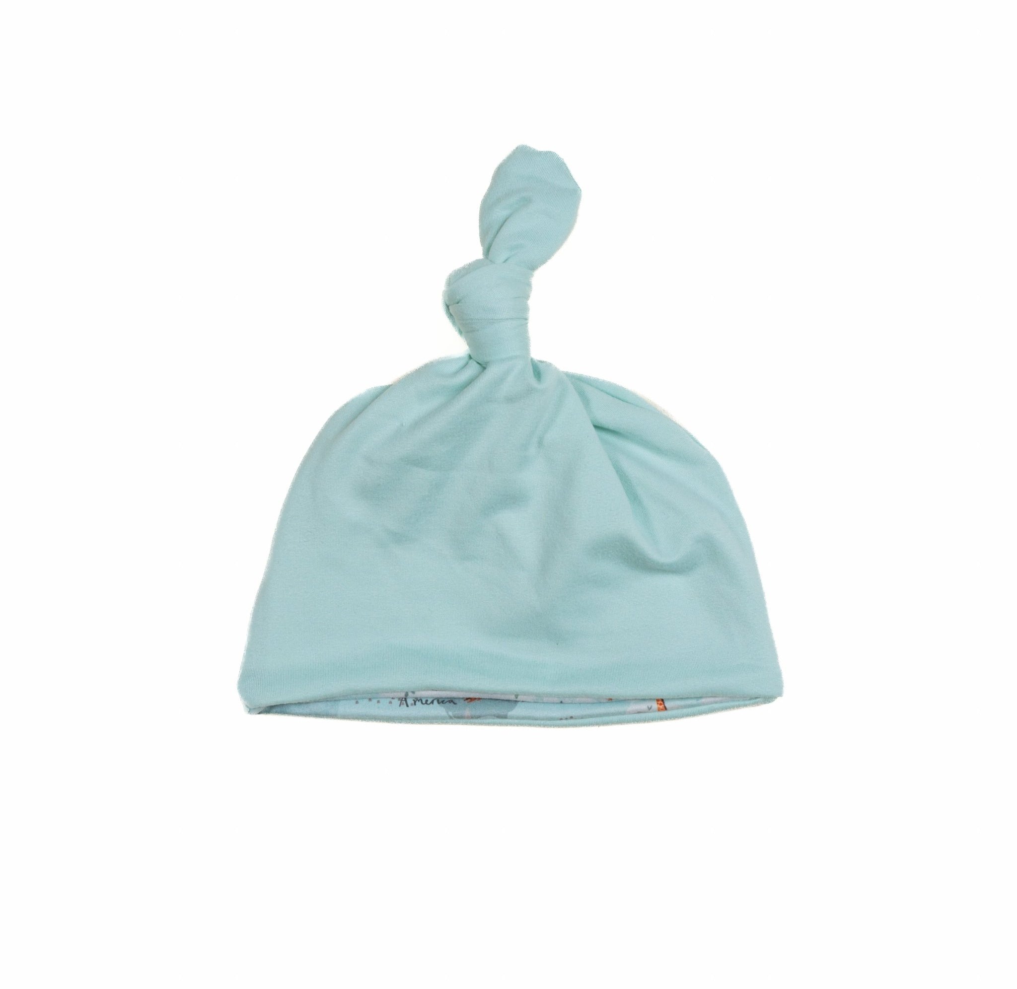 Everyday reversible baby beanie in World Traveler designed with smooth classic brushed fabric.