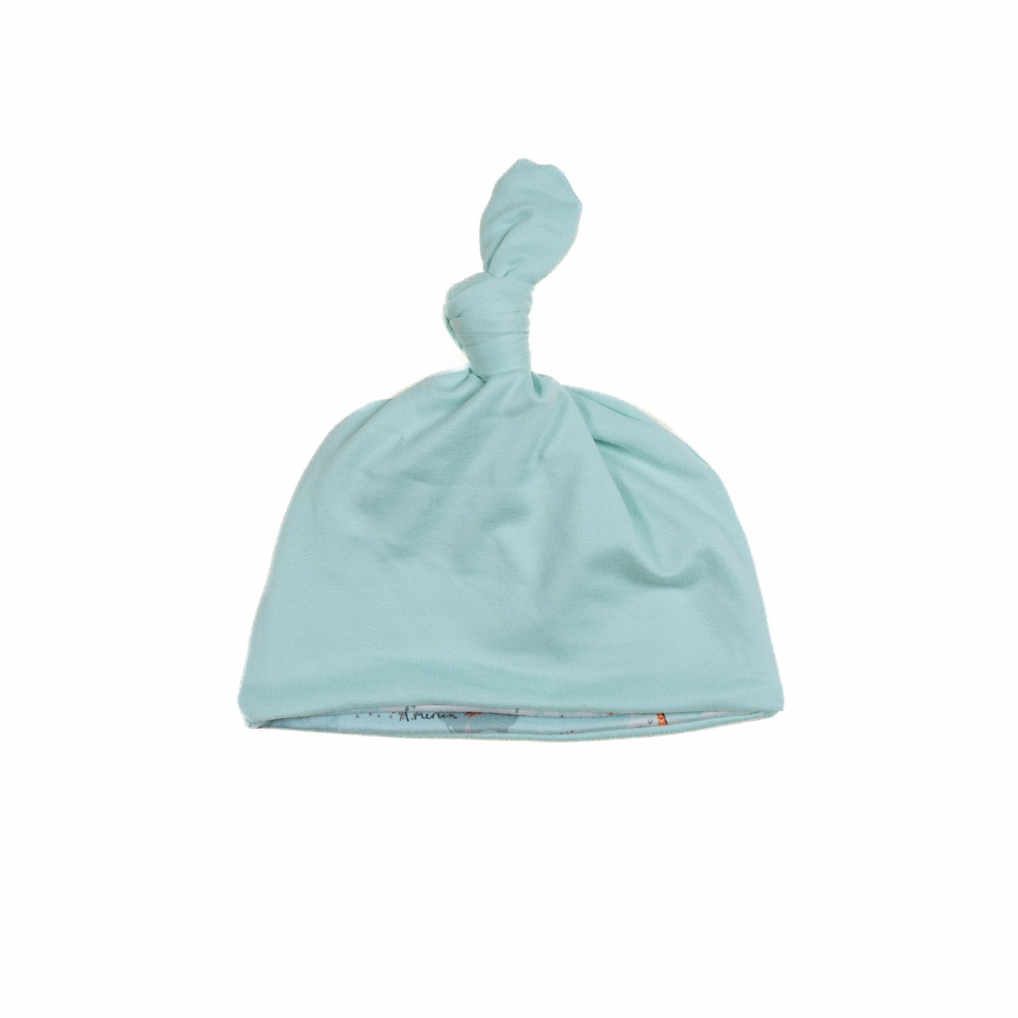 Everyday reversible baby beanie in World Traveler designed with smooth classic brushed fabric.