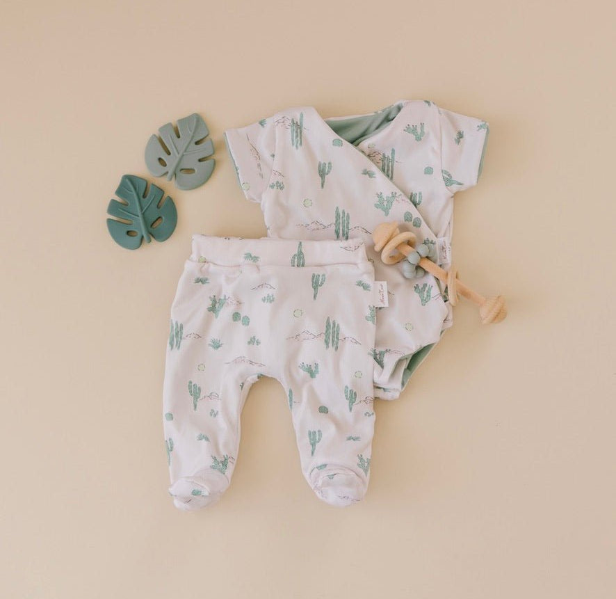 Short-sleeve winged bodysuit featuring the Desert Sunsets print in cozy classic brushed fabric.