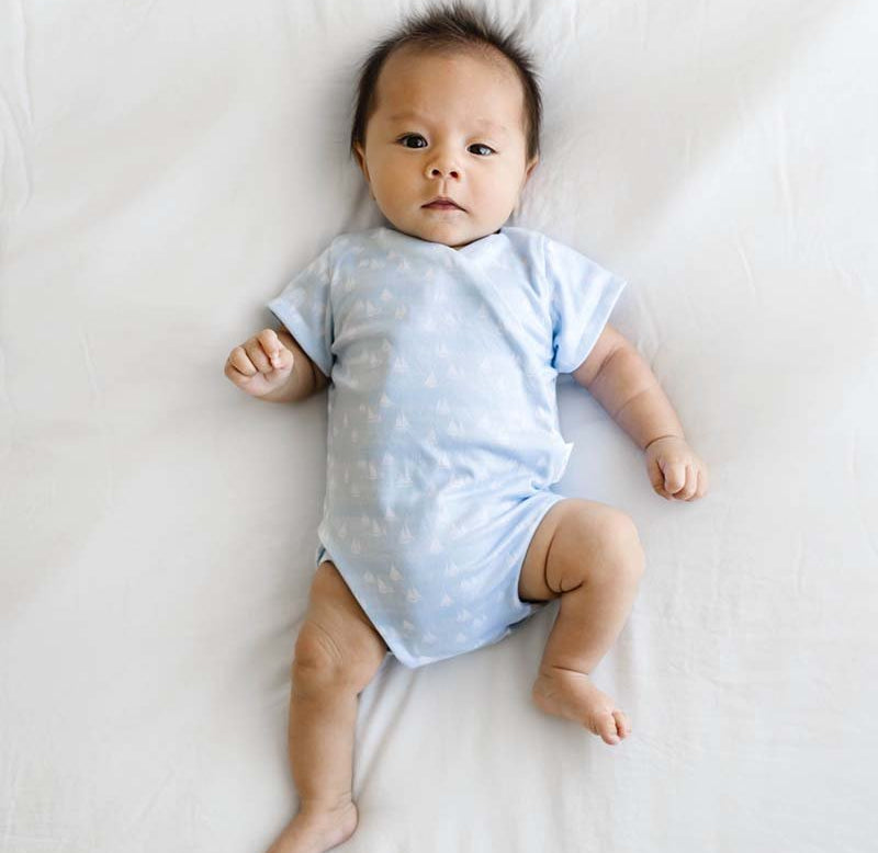 Short-sleeve winged bodysuit featuring the Sailboat Shores print in cozy classic brushed fabric.