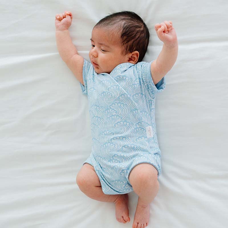Everyday short-sleeve winged bodysuit with Blue Swells print and classic brushed softness.