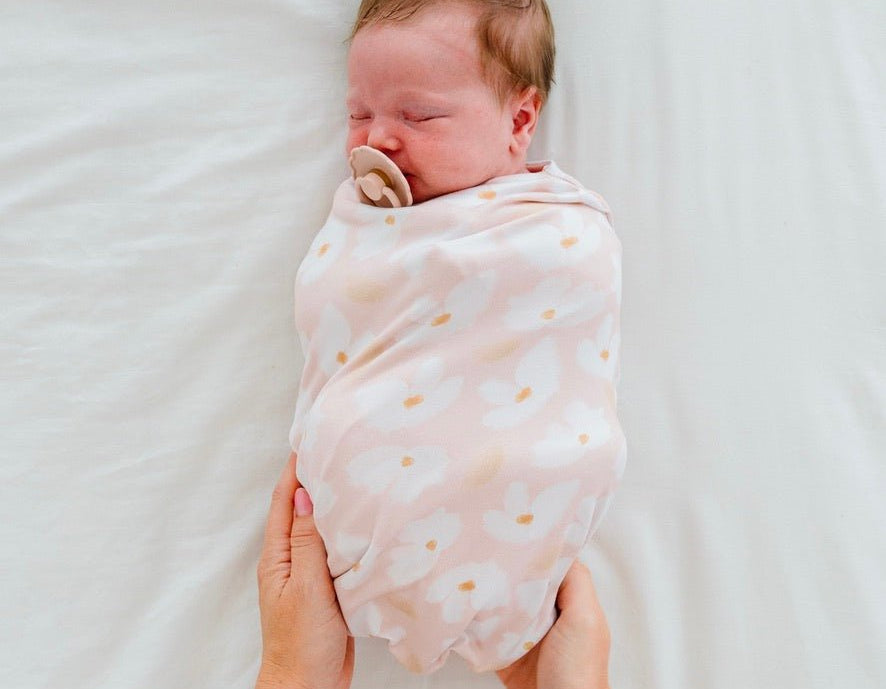 Sweet Lily design baby cocoon swaddle in classic brushed fabric.