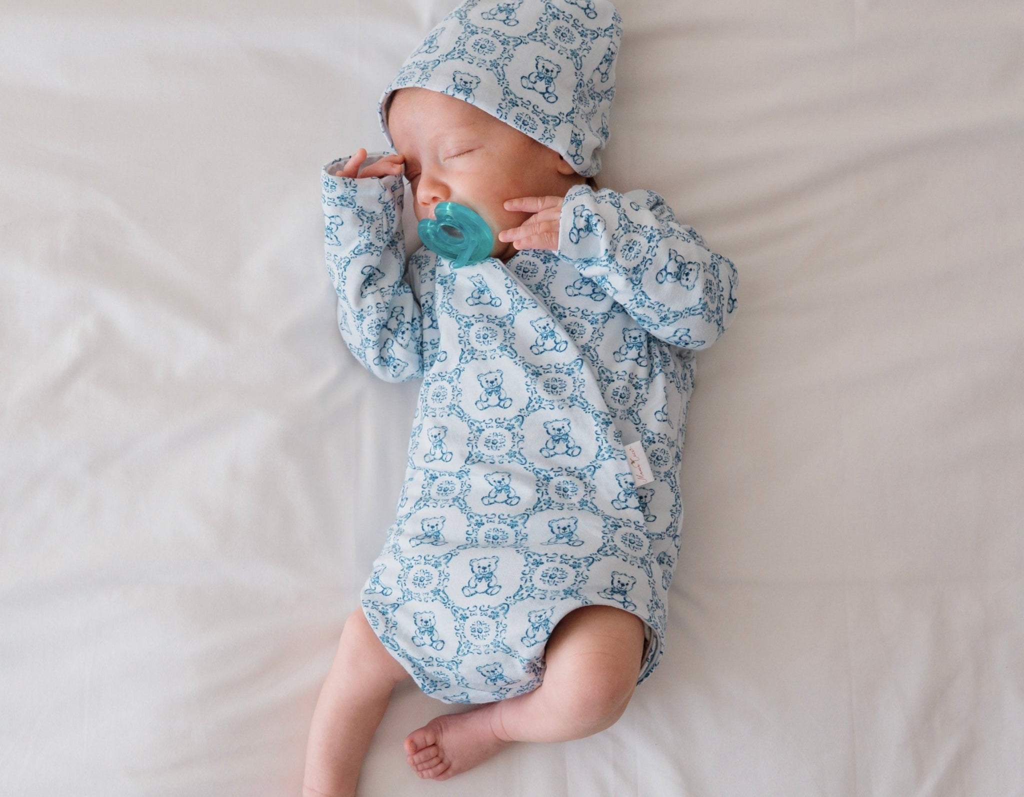 Teddy tiles newborn baby clothing bundle in classic brushed fabric with long sleeve ruffle cuff detail.