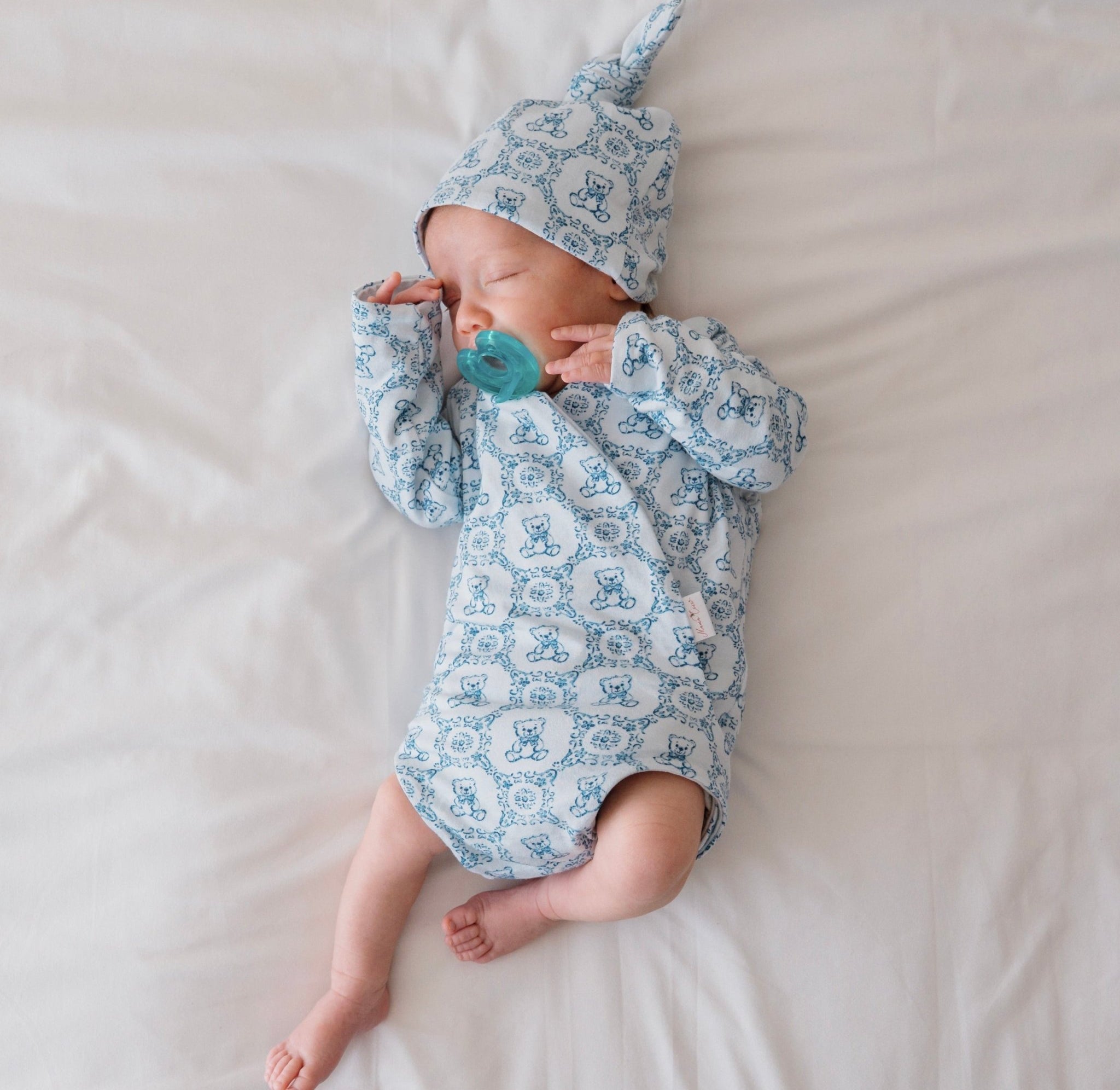 Teddy tiles newborn baby clothing bundle in classic brushed fabric with long sleeve ruffle cuff detail.