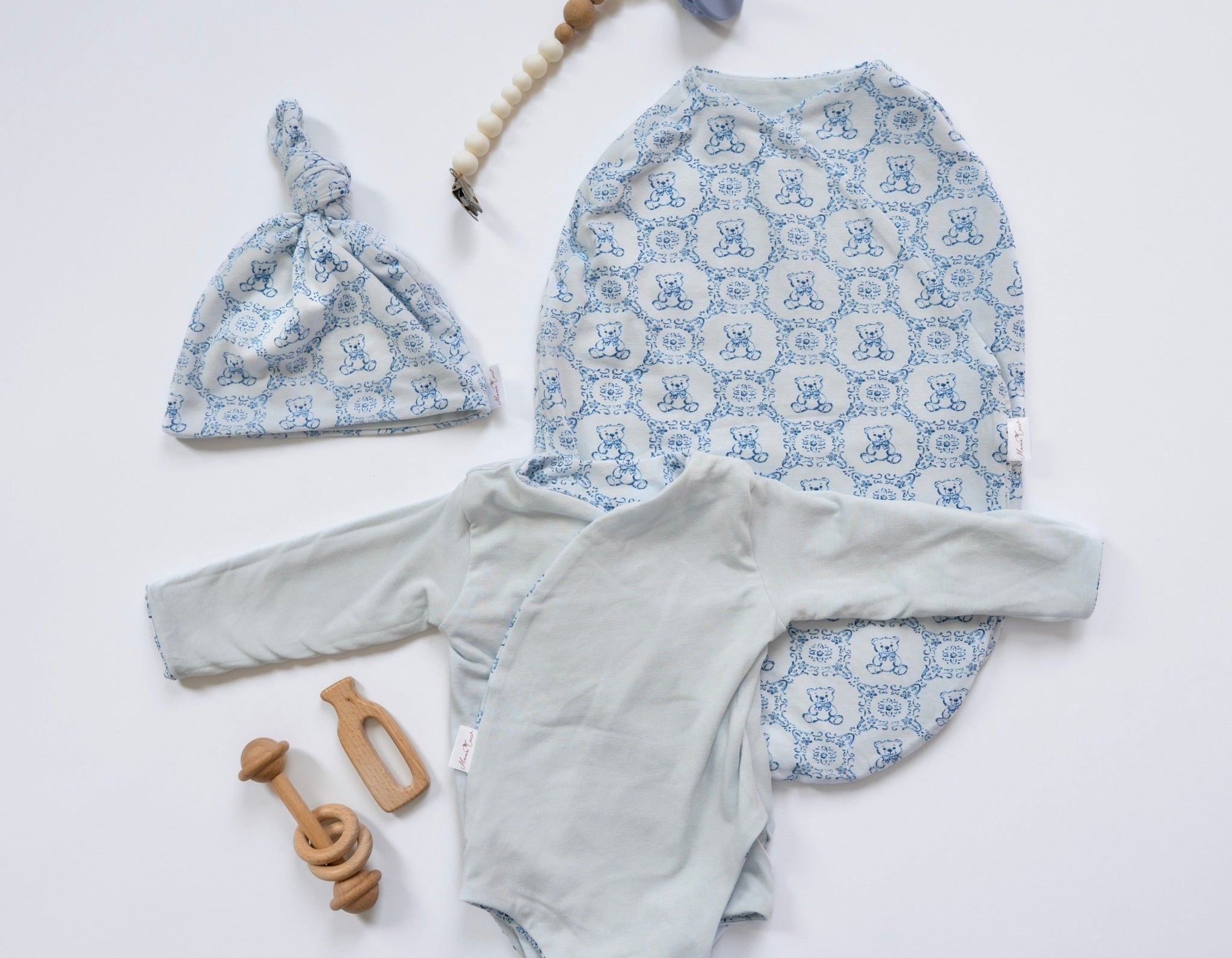 Long-sleeve winged bodysuit newborn baby essentials bundle in bamboo cotton.