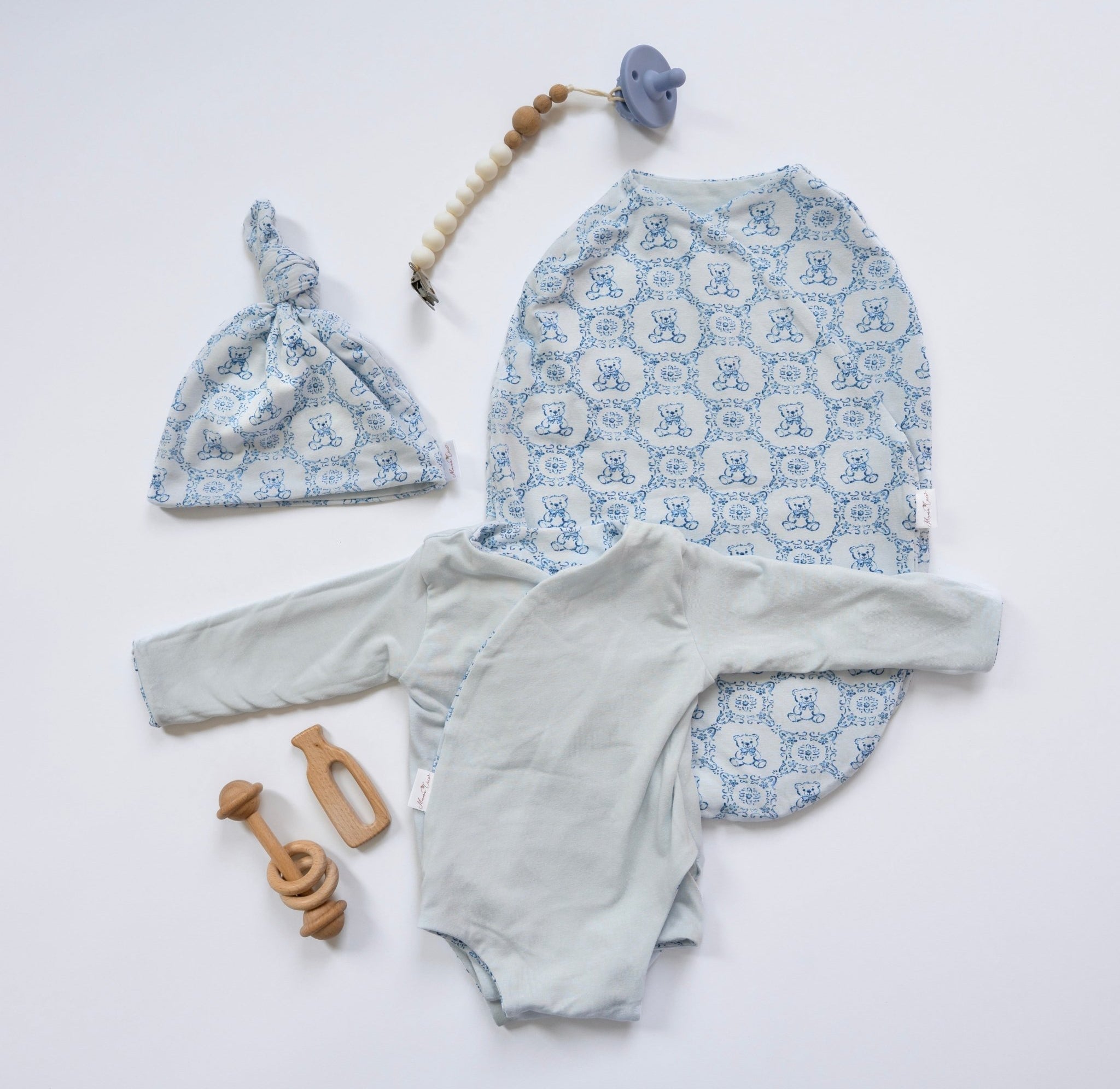Long-sleeve winged bodysuit newborn baby essentials bundle in bamboo cotton.