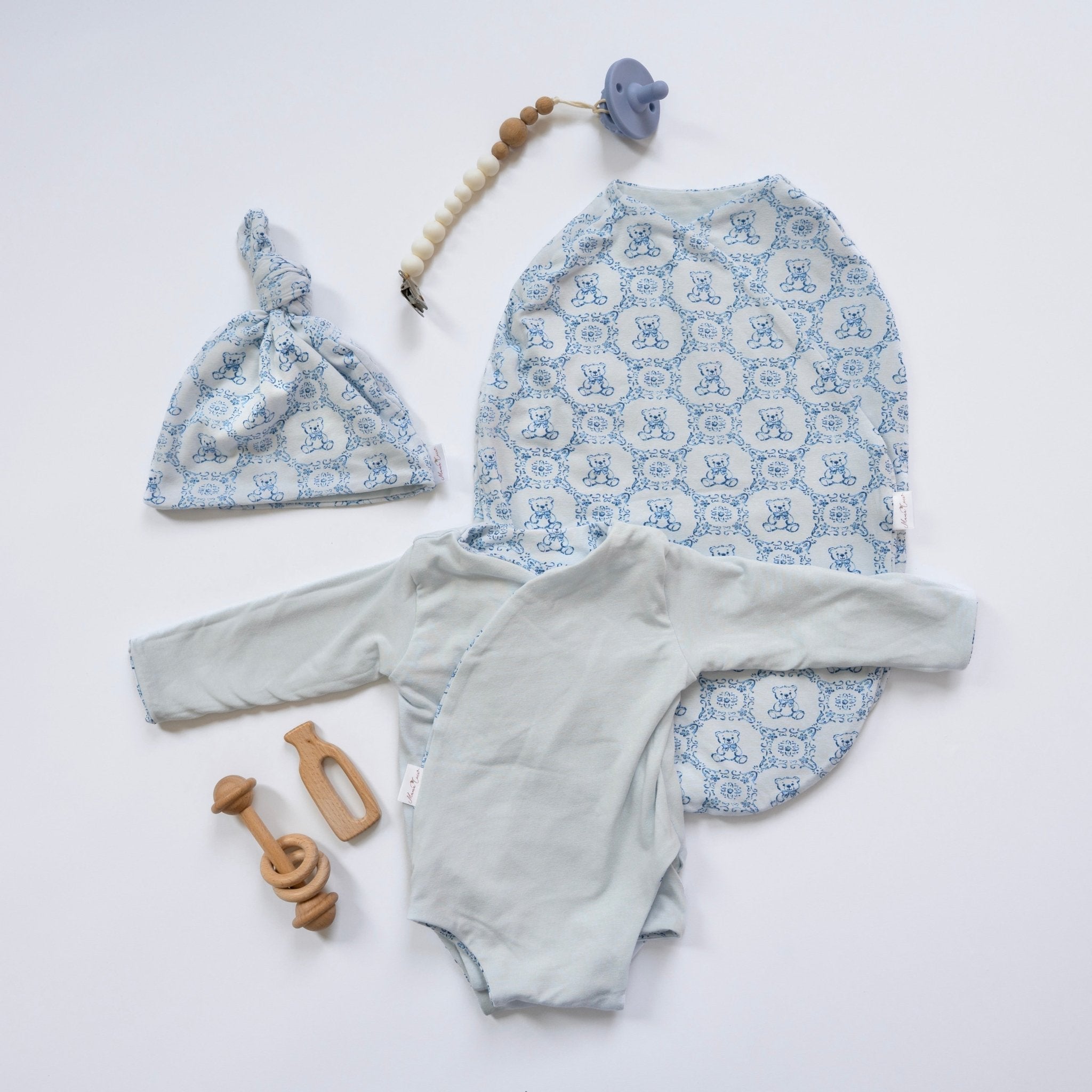 Long-sleeve winged bodysuit newborn baby essentials bundle in bamboo cotton.