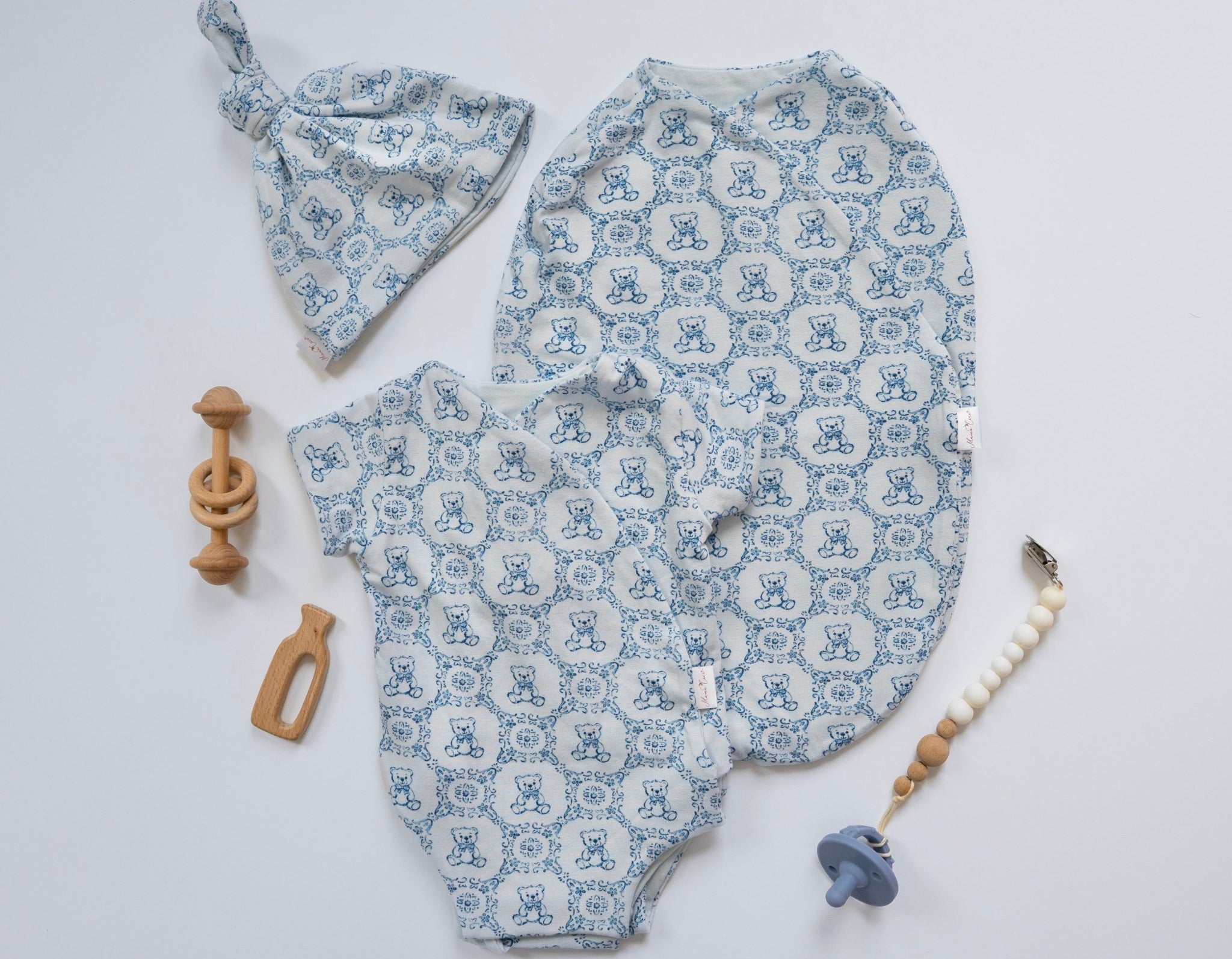 Newborn bundle with short sleeve essentials in bamboo cotton fabric with teddy tiles design.