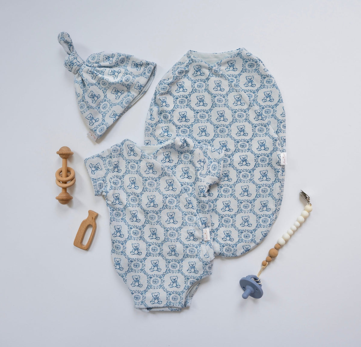 Newborn bundle with short sleeve essentials in bamboo cotton fabric with teddy tiles design.
