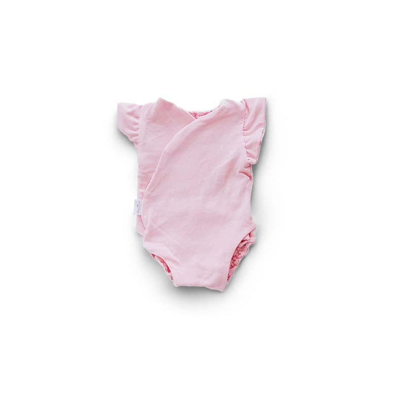 Reversible flutter sleeve winged bodysuit for babies in whimsical garden design.