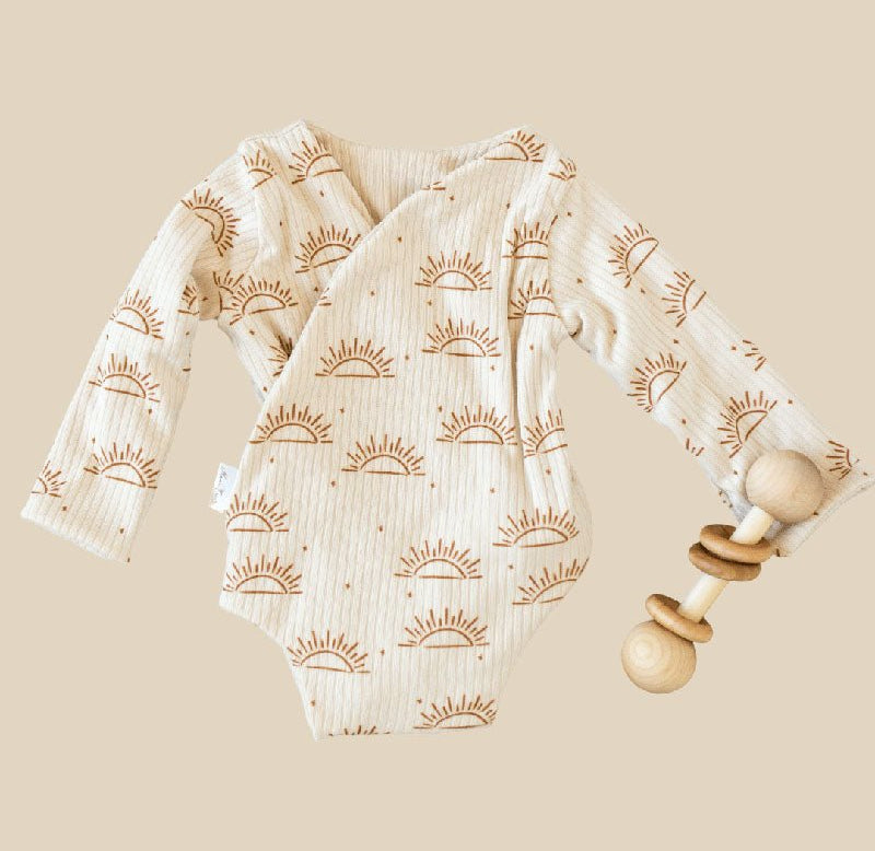 Sandy Sunsets design baby winged bodysuit in classic brushed fabric.