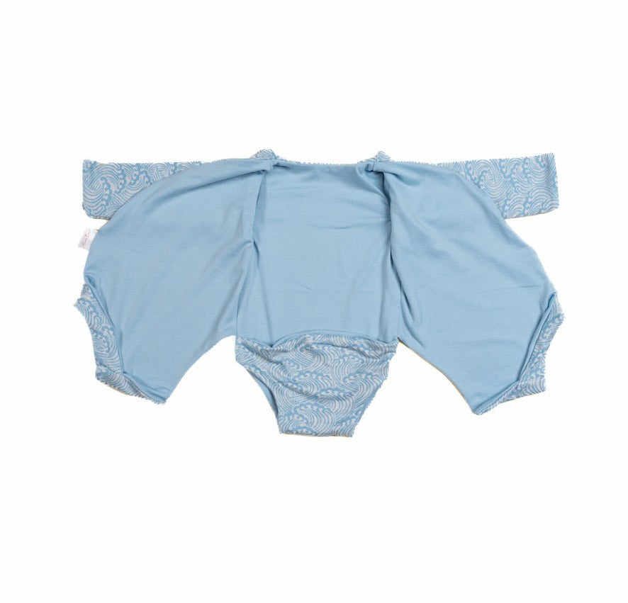 Long-sleeved reversible winged bodysuit for babies in classic brushed fabric.