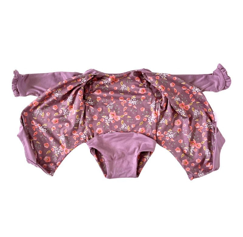 Comfortable Peachy Lilac design brushed fabric baby bodysuit with wings and ruffle trim cuffs.