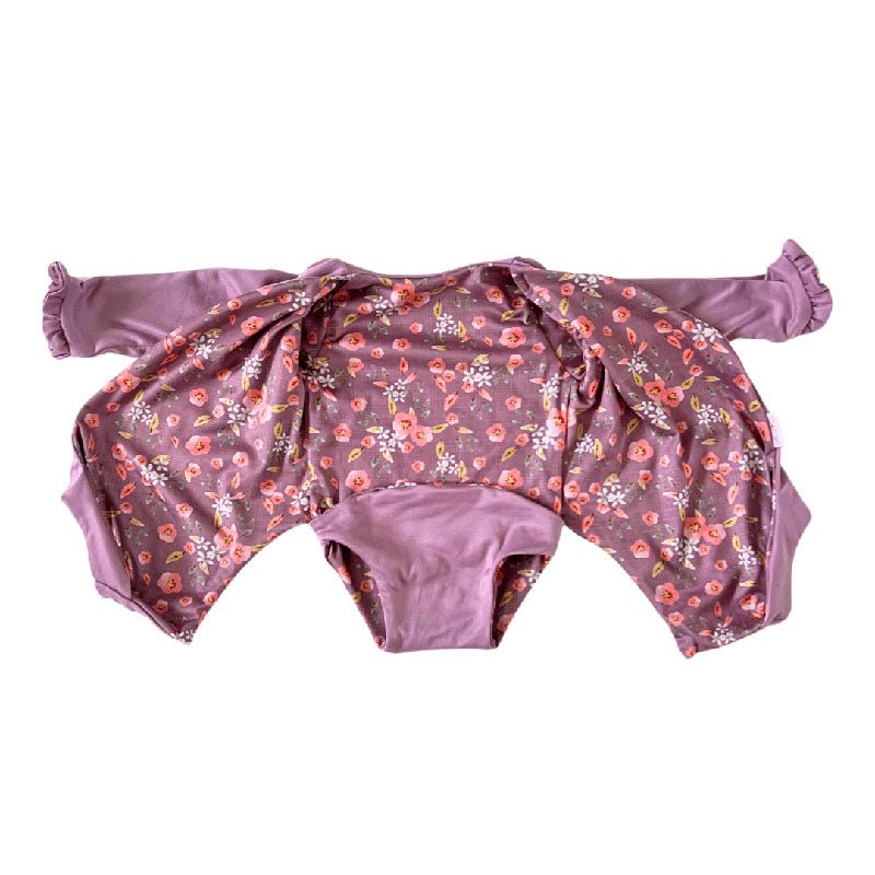 Comfortable Peachy Lilac design brushed fabric baby bodysuit with wings and ruffle trim cuffs.