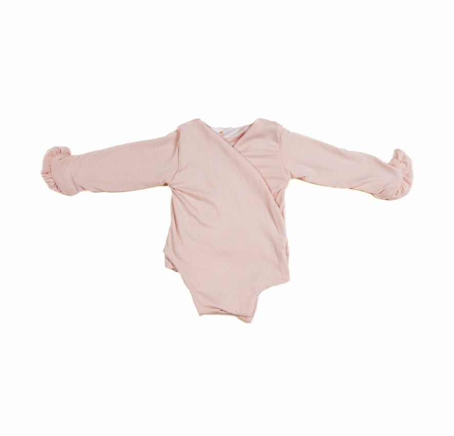 Baby long sleeve bodysuit in Sweet Lily design brushed fabric featuring reversible wings and ruffle cuffs.